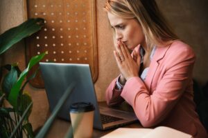 Attractive worried young businesswoman